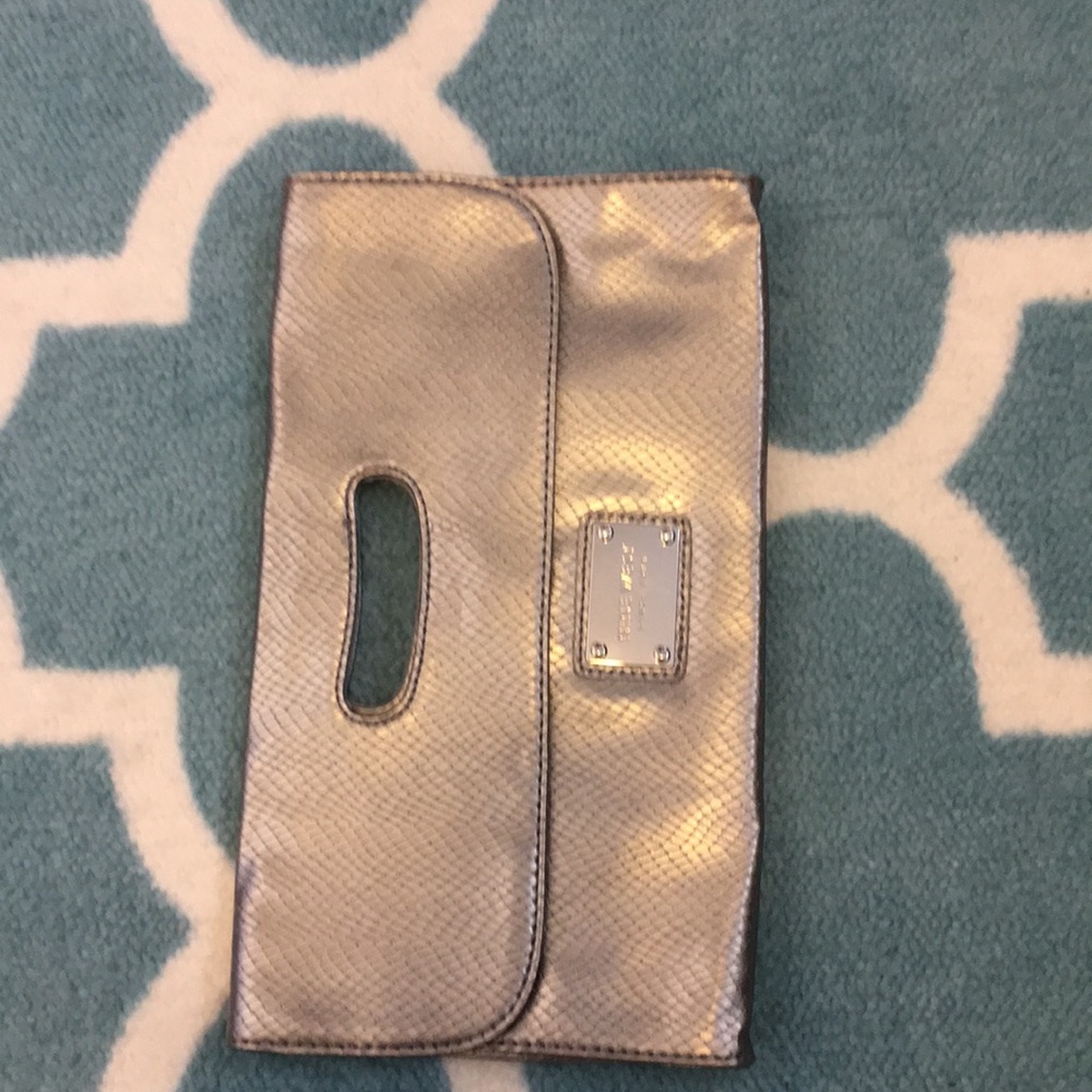 Nine West silver snakeskin pattern clutch.